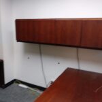 B – Wooden desk with return and hanging cabinets. We are willing to break up the set if you just want the desk or the cabinets.